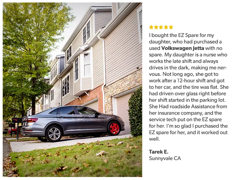 Volkswagen Jetta fitted with EZ Spare Wheel parked in front of a suburban home, illustrating a dependable emergency solution for flat tires, as praised by Tarek E. from Sunnyvale, CA, whose daughter uses it for late-night shifts.